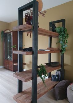 a wooden shelf with some plants on it