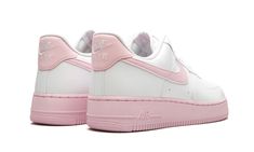 The Nike Air Force 1 Low '07 has returned with yet another vibrant colorway of the iconic silhouette.  A pastel update for the white sneaker fan, this low-top Air Force 1 features a light pink take on the brand’s signature Nike Swoosh on the side and heel tab.  On the lower half, a corresponding light pink sole completes the look and juxtaposes nicely with the all-white leather up top.  Nike Air branding appears on the tongue, heel, and midsole. Yellowstone T Shirts, Foams Shoes, Foam Shoes, Nike Air Force 1 Custom, Air Force 1 Custom, Top Nike, Nike Air Force 1 07, Nike Air Force 1 Low, Stadium Goods