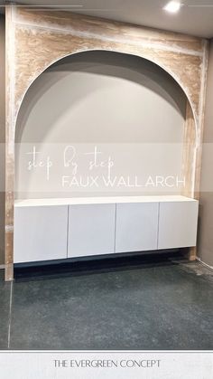 an empty room with a white bench in the center and a sign above it that reads, the evergreen concept faux wall arch