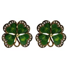 Bring a touch of Victorian charm to your wardrobe with these stunning 14k Victorian Enamel and Seed Pearl 4 Leaf Clover Ear Clips. Made of 14k yellow gold, these ear clips feature delicate enamel details and sparkling seed pearls. In good condition with minor wear, these clips measure 0.75 inches and weigh 6.3 grams. A perfect addition to your jewelry collection! 14k Victorian Enamel and Seed Pearl 4 Leaf Clover Ear Clips Condition: In good condition with some minor surface wear consistent with Gold Enamel Clip-on Earrings, Elegant Yellow Gold Enamel Clip-on Earrings, Yellow Gold Enamel Clip-on Earrings, Yellow Gold Clip-on Enamel Earrings, Green Enamel Clip-on Jewelry, Elegant Enamel Clip-on Earrings, Luxury Green Clip-on Earrings As Gift, Gold Enamel Clip-on Earrings For Gift, Green Enamel Clip-on Earrings As Gift