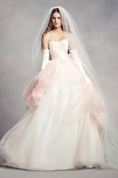 a woman in a wedding dress and veil