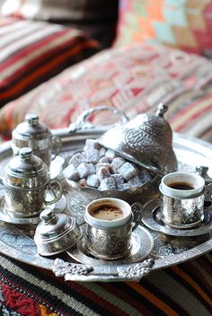 there is a tray with tea and cookies on it