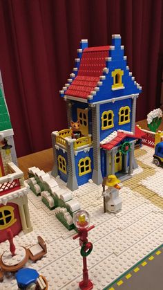 a toy house made out of legos on a table