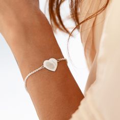 Elevate the art of gift-giving with our Silver Fingerprint Heart Bracelet--a timeless expression of love and connection. The heart-shaped charm at the centre holds a deeply personal touch, featuring the engraved fingerprint of your loved one along with their name creating a uniquely crafted symbol of the special bond you share. The adjustable chain ensures a perfect fit, allowing the bracelet to gracefully adorn any wrist. Flip the heart charm to reveal a canvas for personalisation--add a name, a significant date, or a heartfelt message, turning this exquisite piece into a cherished memento. Delivered in an elegant gift box, the Silver Fingerprint Heart Bracelet is a thoughtful and sentimental gift for any occasion--a beautiful reminder of the timeless connection you both hold dear. Celebr Classic Heart Pendant Bracelet As Gift, Classic Heart Bracelets Suitable As Gifts, Classic Heart Charm Bracelet As Gift, Classic Heart Charm Bracelet Gift, Engraved Heart Bracelet For Anniversary, Heart-shaped Engraved Bracelets For Wedding, Heart Bracelet With Charm As Gift For Her, Heart Shaped Bracelet With Heart Charm For Her, Heart Charm Bracelet Gift For Her