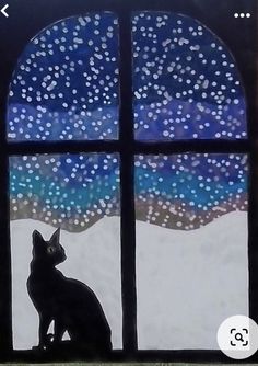 a black cat sitting on top of a window sill in front of a night sky