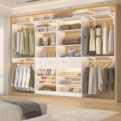 an open closet with clothes, shoes and bags on shelves in front of a bed