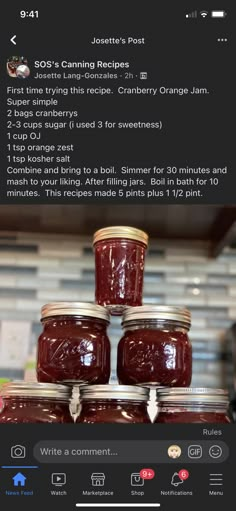 jars of jam are stacked on top of each other in front of a kitchen counter