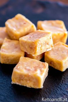 several pieces of peanut butter fudge on a black plate