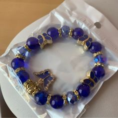 Brand New In Sealed Package Blue Beaded Bracelet With Butterfly Charm Blue Adjustable Charm Bracelet For Party, Adjustable Blue Charm Bracelet For Party, Adjustable Blue Charm Bracelet For Parties, Casual Blue Adjustable Charm Bracelet, Blue Beads For Jewelry Making, Casual Blue Beaded Jewelry, Blue Charm Bracelet For Party, Casual Blue Bracelets With Faceted Beads, Casual Blue Bracelet With Faceted Beads