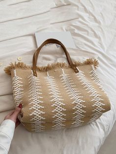 Elevate your beach style with Summer Chic: Fringed Large Capacity Tote Bag. With its spacious design, you can easily carry all your essentials. The fringed details add a touch of effortless style, making it perfect for a day at the beach. Stay in fashion while staying organized. Color : Beige Strap Type : Double Handle Details : Fringe Bag Size : Large Style : Vacation Type : Shoulder Tote Bag Closure Type : Buckle Pattern Type : Colorblock Features : High-capacity Material : Polyester Composition : 100% Polyester Bag Height Bag Length Bag Width 33 43 15 Trendy Beige Beach Bag For Beach Season, Trendy Beige Beach Bag, Trendy Summer Beach Bag With Tassels, Brown Beach Bag With Tassels For Summer, Trendy Beach Straw Bag With Tassels, Summer Brown Beach Bag With Tassels, White Bohemian Beach Bag For Summer, White Casual Beach Bag, Summer Beach Bag With Fringe For Travel