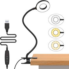 an electronic device with three lights attached to it and two cords connected to each other