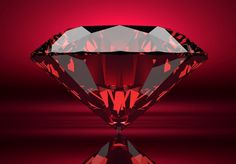 a red diamond with reflection on the surface