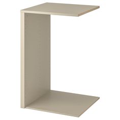 a white shelf with two shelves on each side and one shelf in the other corner