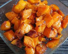 a glass bowl filled with cooked sweet potatoes