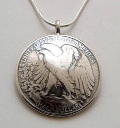 Pendant made from a vintage silver American Walking Liberty half dollar coin.  The back is domed as the front of the pendant. Yours may have a soldered ring as pictured, or it may be drilled, with a free-flowing ring, depending on what we have in stock. This pendant comes on a sterling silver bead chain.  Please select length from the drop-down menu.Thanks for looking.  Enjoy! Antique Sterling Silver Coin Necklace With Round Pendant, Handmade Silver Coin Necklace, Handmade Silver Round Coin Necklace, Handmade Vintage Round Coin Necklace, Collectible Sterling Silver Coin Necklace With Round Pendant, Heirloom Silver Coin Jewelry, Antique Commemorative Round Jewelry, Vintage Silver Coin Jewelry, Classic Stamped Jewelry For Memorial Occasion