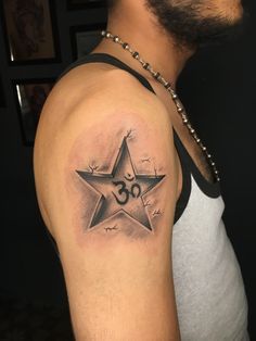 a man's arm with a star tattoo on it, and the number thirty