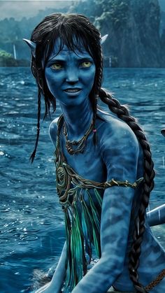 a woman with blue skin and braids on her head sitting in the water next to a boat