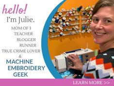 a woman is smiling and holding a sewing machine