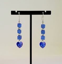 Stunning Swarovski Faceted Sapphire Blue Crystal Dangle Earrings in 6mm Cubes and 14mm Xilion Hearts AB. Crystal AB stands for Aurora Borealis referring to picking up colors around it. See Pink or Magenta occasionally in the Hearts. 925 Sterling Silver 4mm Corrugated Beads accent. Nice swing to these 2 1/8" Length Earrings. You will dazzle them in these pretty Earrings!!! Blue Heart Beads Jewelry For Anniversary, Blue Heart Cut Jewelry For Jewelry Making, Blue Sterling Silver Jewelry With Heart Beads, Blue Jewelry With Matching Earrings For Valentine's Day, Sterling Silver Jewelry With Blue Heart Beads, Handmade Blue Heart Cut Jewelry, Blue Sterling Silver Heart Earrings For Pierced Ears, Blue Crystal Jewelry With Matching Earrings, Sterling Silver Blue Heart Beads Jewelry