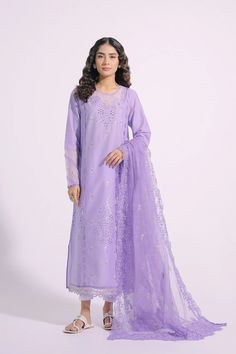 An aesthetically appealing composition is portrayed on this graceful outfit rendered in an appealing lilac shade. It features a classy silhouette shirt beautifully adorned with intricate embroidery at front and sleeves illustrating captivating floral designs with schiffli technique. Paired with a gracefully draped embroidered dupatta with scalloped borders, this gorgeous outfit is a style statement for formal gatherings this season. -Lilac Color -Fabric: Lawn Shirt & Nylon Stripe Dupatta -2 piece Unstitched Elegant Kurta With Cutwork, Elegant Unstitched Kurta With Cutwork, Elegant Unstitched Cutwork Kurta, Elegant Long Sleeve Salwar Kameez With Cutwork, Elegant Semi-stitched Purple Sets, Unstitched Elegant Salwar Kameez With Cutwork, Elegant Unstitched Salwar Kameez With Cutwork, Lavender Salwar Kameez With Resham Embroidery For Eid, Formal Chikankari Embroidered Lawn Suit