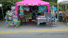 a pink tent with tie dye designs on it