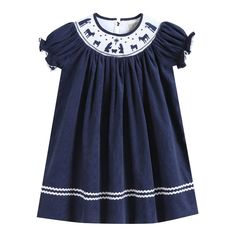 Navy Blue Corduroy Nativity Smocked Bishop Dress Charming and cute! Your little cuties closet is not complete without this adorable outfit. They will love spending their days in this outfit made out of 100% soft cotton. Cute details make it a one of a kind addition to their closet. This Bishop dress is the traditional length with hemline reaching the calf/ankle. From festive activities or just fun days at home your little sweetie will be ready and picture perfect! -100% Cotton -Machine Wash -Man Smocked Bishop Dress, Festive Activities, Smocked Clothes, Dress Infant, Timeless Outfits, Christmas Dresses, Blue Corduroy, Flowing Dresses, Playsuit Romper