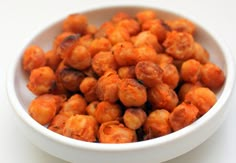 a white bowl filled with chickpeas on top of a table