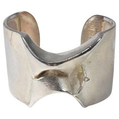 This bracelet is part of the space silver series by Bjorn Weckstrom for Lapponia. This design was called the "Man from Mercury". This Scandinavian modern cuff bracelet is marked 925 Sterling and Finland on the inside of the cuff. There is some tarnishing and weighs 68 grams. 1 9/16" wide x 6" circumference (without the opening) x 1" opening Luxury Silver Modernist Bracelets, Viking Style Silver Metal Bracelet, Silver Viking-style Jewelry Gift, Modernist Silver Jubilee Bracelet, Modernist Hallmarked Sterling Silver Bracelet, Arm Band, Cuff Bracelet, Bracelets For Men, Jewelry Collection