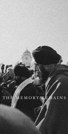 a black and white photo of a man in a crowd with the words the memory remains on it