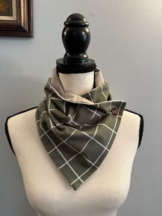 **Ready to Ship** Handmade soft cotton flannel bandana style scarf. Sage green window-pain flannel with white lines, lined with soft grey flannel, and one brown button with coordinating buttonhole.  Perfect accessory to keep you warm and stylish for the fall and winter.  Easy to wear with your coat in the winter and over a sweater. Makes a wonderful gift for yourself or anyone who wants to be cozy! The finished size is approximately 30 inches in length and 9 inches wide, wear it as part of your outfit or as a scarf for those chilly outings! Easy all-day wear without the bulk of a full scarf. This scarf is: -Made of soft cotton flannel and in a smoke-free environment. -Machine wash delicate cold. Tumble-dry low. *Fabric may shrink in the dryer* recommend hanging to dry to prevent fabric fro Casual Cotton Bandana For Outdoor, Casual Fall Scarves, Green Casual Scarves One Size, Casual Green Scarves One Size, Casual Green Scarf, Casual Cotton Scarves For Winter, Casual Cotton Winter Scarves, Green Cotton Casual Bandana, Casual Green Cotton Bandana