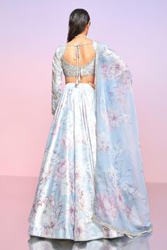 Light dusty periwinkle lehenga featuring floral bloom print with stone work. Paired with a padded blouse showcasing all-over thread, bead, and sequin embroidery, along with a floral print dupatta with embroidered borders., Fit: Relaxed Floral Print Lehenga For Spring Wedding, Fitted Floral Print Lehenga For Wedding, Elegant Organza Choli With Floral Print, Wedding Sets In Organza With Floral Print, Spring Floral Print Elegant Lehenga, Spring Wedding Lehenga With Floral Print, Wedding Organza Sets With Floral Print, Wedding Sets With Floral Print On Organza, Spring Wedding Lehenga With Sheer Dupatta