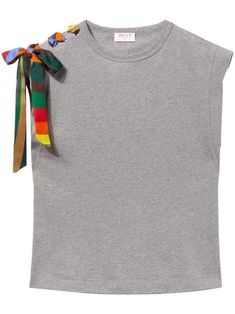 a grey shirt with multicolored bows on the shoulder