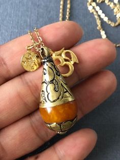 Give or have this necklace to guide you to the right direction to the enlightenment. This will make a great gift to whom are searching for true self and wisdom. *Orange Resin Pendant measures 38mm x 15mm ---------------------------------------- https://www.etsy.com/listing/111962735/yoga-jewelry-tibetan-bead-jewelry-pearl?ref=shop_home_active_2 ---------------------------------------- *JEWELRY CARD OPTIONS* Please indicate your choice of a message or your personals message in the 'message to sel Bohemian Adjustable Charm Necklaces As Gift, Bohemian Adjustable Charm Necklace For Gift, Spiritual Style Long Nickel-free Necklace, Adjustable Pendant Charm Necklace For Meditation, Bronze Amulet Necklace For Blessing, Bohemian Charm Necklace With Round Pendant For Gifts, Bohemian Brass Necklaces For Rituals, Handmade Bronze Jewelry For Blessing, Bohemian Brass Necklace For Rituals