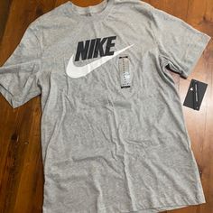 Grey Nike Logo Tshirt Casual Cotton T-shirt In Athletic Heather, Nike Cotton T-shirt With Relaxed Fit, Nike Cotton T-shirt In Relaxed Fit, Nike Athletic Heather Crew Neck T-shirt, Cotton Athletic Heather T-shirt With Logo Print, Casual Nike Crew Neck T-shirt, Nike Cotton T-shirt In Athletic Heather, Casual Athletic Heather T-shirt With Logo, Casual Athletic Heather Cotton T-shirt