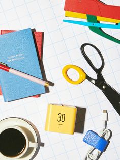 office supplies laid out on top of a notebook