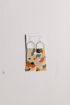 the earrings are made from woven material