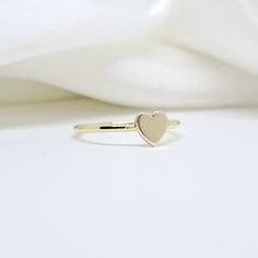 An all-gold and shiny heart will adorn your hand  🤍🤍 🤍 Details  The heart's size is 5,7mm. x  5,8mm. (approx.) and  thickness of heart is 1,00mm.(approx.) The band's thickness is 1,30mm.(approx.)  flat on the inside and slightly curved on the outside. 🤍 Materials All our items are made of 9 karats, 14 karats, or 18 karats solid gold upon request. We like to use yellow gold, white gold, and rose gold to please your color of choice. Use the drop-down material menu to find your favorite option. 14k Gold Stackable Rings With Heart Charm, 14k Gold Stackable Heart Cut Heart Ring, Stackable 14k Gold Heart Cut Heart Ring, Stackable 14k Gold Heart Cut Ring, Heart-shaped 14k Gold Stackable Promise Rings, Rose Gold Heart Cut 14k Gold Ring, Rose Gold 14k Heart Cut Ring, Gold 14k Heart-shaped Stackable Rings, Gold Heart-shaped Stackable Rings