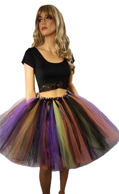 "Create your costume using this fluffy made to order witch tutu skirt. This skirt is made by tying strips of tulle to an elastic band and comes with a decorative satin black bow. The colors are Black, Orange, Purple, and Green Apple. Available in child and adult sizes. Child size 14 through adult sizes will be 20\" in length. Child sizes smaller than a 14 will be around knee length. Please message me before purchasing if you would like the skirt longer. Adults pick your size based on the size ch Fairycore Halloween Cosplay Costumes, Fairycore Costume For Halloween Cosplay, Fantasy Skirt For Halloween Costume Party, Witchy Fitted Skirt For Cosplay, Black Mini Skirt For Halloween Cosplay, Fantasy Costume Black Skirt, Fantasy Black Skirt For Costume, Witchy Fitted Skirt For Costume Party, Gothic Skirt For Halloween Festival