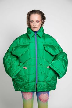 Unisex quilted jacket "Lupinus Green" features a round shoulder and oversized fit for a relaxed, comfortable feel. It's made from lightweight, wrinkle-free polyester and has large pockets, windproof, and water repellent properties. The soft, bold shape makes it a statement piece, and the hypoallergenic synthetic padding adds warmth without compromising style.Size Guide:ONE SIZE (fits to XS-XL)Collar - 51 cmWides middle line - 170 cmBottom line - 140 cmSleeve ends - 57 cmLength from the neckline Oversized Quilted Outerwear For Cold Weather, Oversized Quilted Long Sleeve Jacket, Oversized Quilted Nylon Outerwear, Oversized Quilted Puffer Jacket For Spring, Oversized Quilted Long Sleeve Outerwear, Oversized Quilted Outerwear With Long Sleeves, Oversized Nylon Puffer Jacket For Streetwear, Oversized Long Sleeve Puffer Quilted Jacket, Oversized Puffer Quilted Jacket With Long Sleeves