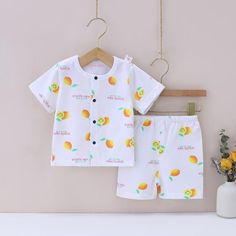 Baby Boy Fruit Print Geometric Pattern Pajama Top & Shorts - PrettyKid Orange Cotton Sleepwear For Summer, Orange Cotton Summer Sleepwear, Cartoon Print Cotton Sleepwear For Summer, Yellow Family Matching Cotton Sets, Family Matching Cotton Sets In Yellow, Yellow Cotton Family Matching Sets, Playful Cartoon Print Summer Sleepwear, Playful Summer Sleepwear With Cartoon Print, White Cartoon Print Sleepwear For Summer