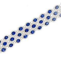 The Sapphire and Diamond Bracelet exudes an air of regal elegance, combining the rich allure of sapphires with the dazzling brilliance of diamonds, all set within an 18KT white gold frame. Wearing this bracelet is akin to wearing a work of art. 54 Sapphires - 23.79CT 54 Round Diamonds - 3.18CT 756 Round Diamonds - 5.64CT 18KT White Gold Regal Elegance, The Dazzling, Unique Bracelets, Sapphire Gemstone, White Diamonds, Gold Frame, Diamond White, Instagram Followers, Blue Sapphire