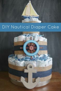 a diaper cake with an anchor and sailboat on top