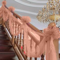 the staircase is decorated with pink organ - streamers