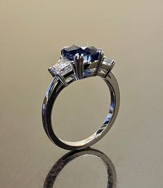 an engagement ring with three stones on it