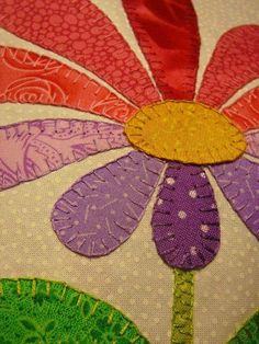 a close up of a flower on a piece of fabric