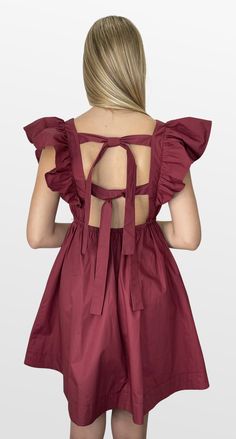 Definitely the plan. This color-match babydoll dress mixes trend and comfort. The fitted lined bodice has an open back that double ties for the perfect fit. The shoulder ruffle sleeves are just the right touch with a full skirt that gives plenty of movement and comfort. Look your best on Gameday! Color- Burgundy (Also Available in Crimson, Navy, and Purple) 100% Cotton Lining- 100% Polyester Backless Ruffle Dress For Casual Occasions, Ruffled Backless Dress, Tie Back Ruffle Sleeve Dress For Brunch, Tie Back Dress With Ruffle Sleeves For Brunch, Brunch Dress With Tie Back And Ruffle Sleeves, Flutter Sleeve Dresses With Tie Back For Brunch, Ruffle Shoulder Dress, Game Dresses, Red Green Yellow