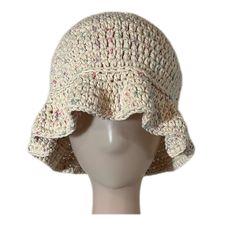 a crocheted hat on a mannequin head