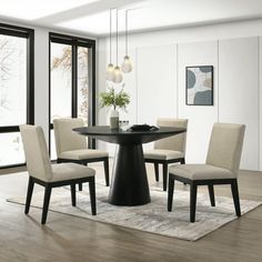 a dining room table with chairs around it