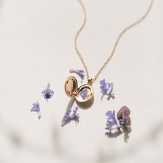 "This vintage-style locket holds lots of love. Choose your chain and add an initial--then use it to store tiny notes, flower seeds or any other small treasures you want to keep close. We even made you a template for adding photos: https://cdn.shopify.com/s/files/1/0282/6115/4947/files/Locket_Template.pdf?v=1610493978  Every piece is handcrafted and hand-personalized with love in La Conner, WA, using 90% recycled and 100% ethically sourced raw materials from the USA--because it's better that way. Includes free gift-ready packaging (featuring a care card and traditional letterpress goodies made by my dad)!  MATERIALS: * Gold = 14k gold filled * Silver = sterling silver DETAILS: * 9x13mm locket * Chain adjustable by 2\" * Hand-personalized with traditional metal punches AT CHECKOUT: * If you Dainty Locket Jewelry, Heirloom White Gold Locket Necklace, Dainty Yellow Gold Locket Necklace With Adjustable Chain, Elegant 14k Gold Locket Necklace With Vintage Charm, Delicate Rose Gold Locket Jewelry, Vintage Charm Pendant Jewelry For Anniversary Gift, Dainty Engraved Pendant Locket Necklace, Dainty Locket Necklace With Adjustable Chain For Wedding, Vintage Pendant Jewelry For Anniversary Gift