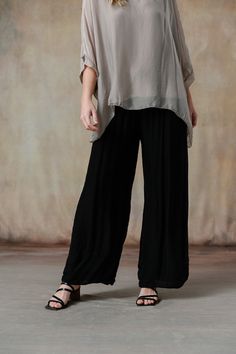 You'll swoon over our Madelyn Pants, where luxurious Italian silk meets impeccable design. These pants feature a comfortable waistband and a flattering wide-leg cut, offering a perfect blend of elegance and ease. Available in stunning colorways that seamlessly coordinate with our effortless tops and cozy knitwear, the Madelyn Pants make full-body dressing an art form. Part of our mix-and-match Italian Silk assortment. Classic fit. One size fits most. Full-length wide-leg pant, foldable jersey wa Solid Wide-leg Viscose Pants, Solid Viscose Wide-leg Pants, Bohemian Wide Leg Silk Pants, Bohemian Silk Wide Leg Pants, Bohemian Silk Wide-leg Pants, Loosely Fitted Viscose Wide Leg Pants, Elegant Black Viscose Pants, Versatile Solid Viscose Pants, Versatile Solid Color Viscose Pants